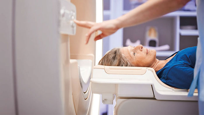a woman lying in a baby bed